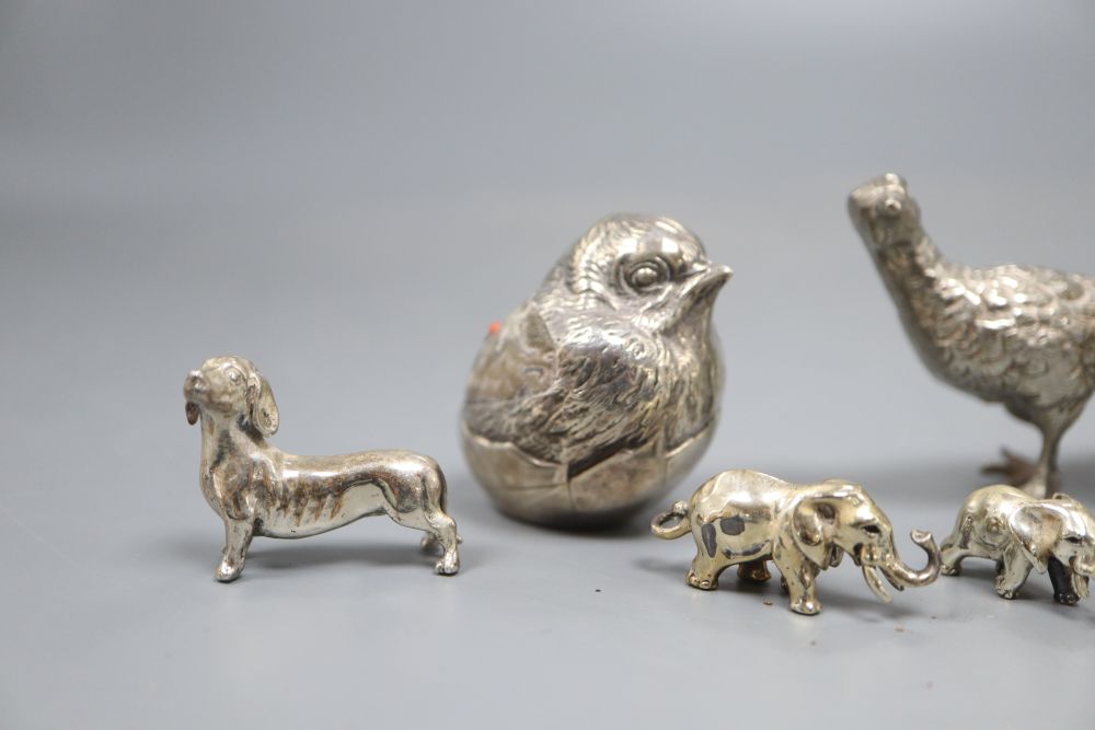 An Edwardian silver mounted hatching chick pin cushion, etc.